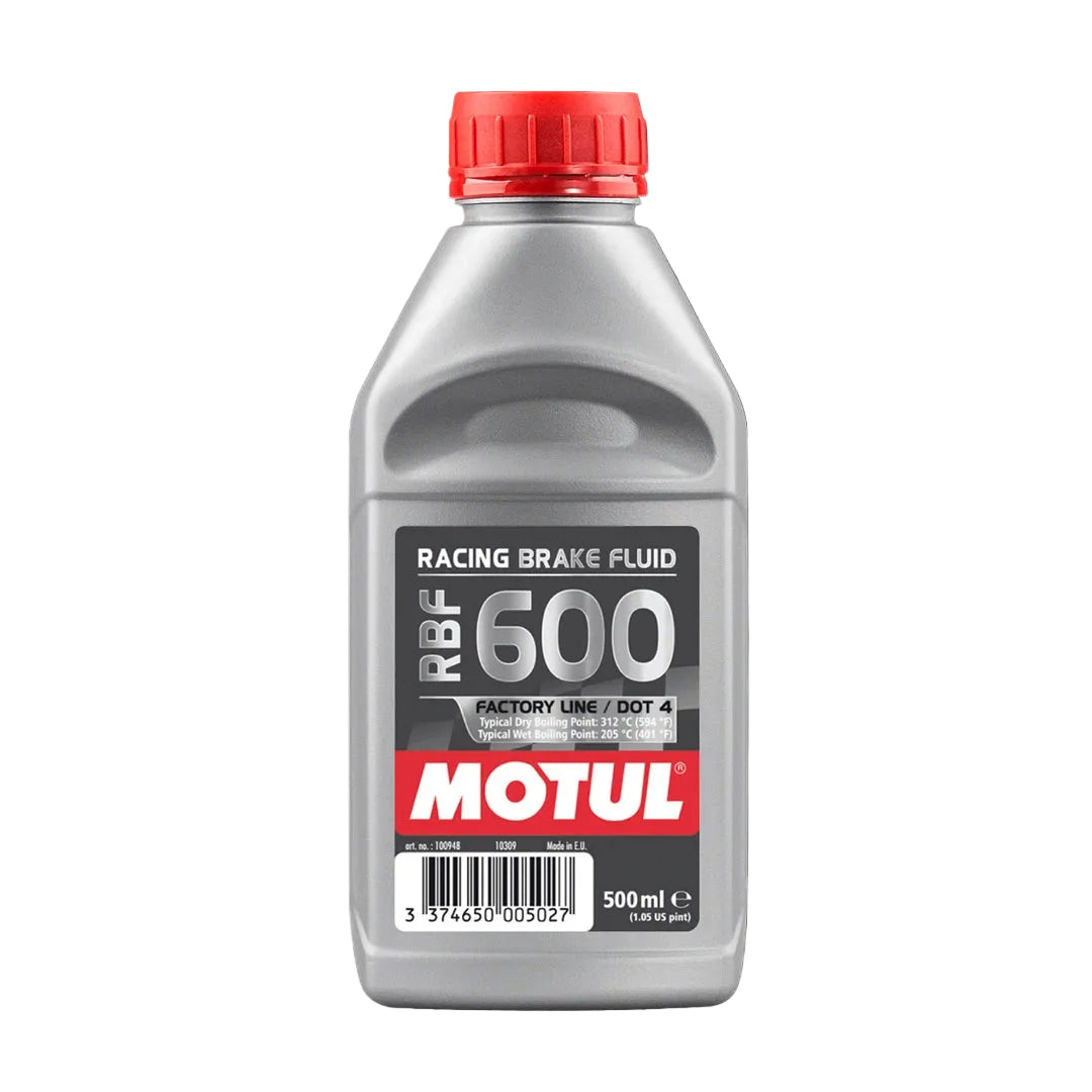 Motul RBF 600 racing brake fluid bottle with red cap on a white background