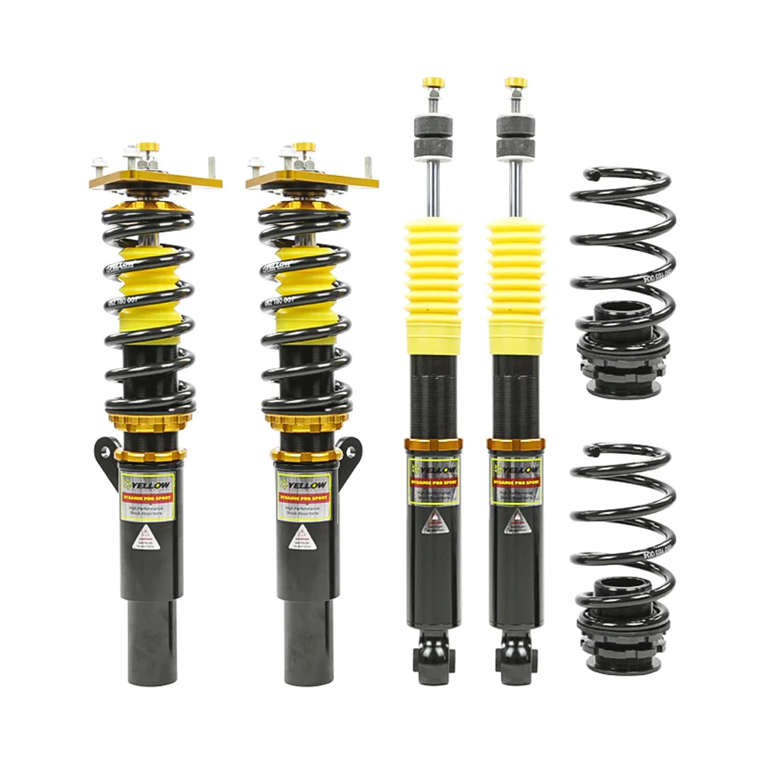Set of four yellow speed racing coilovers on a white background