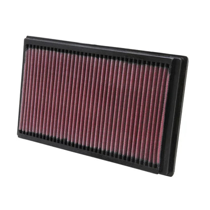 K&N red pleated high performance air filter on a white background