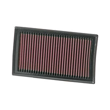 K&N red pleated high performance air filter on a white background