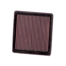 K&N red pleated high performance air filter on a white background