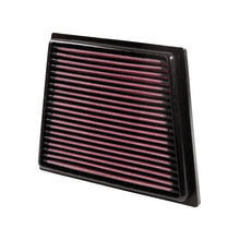 K&N red pleated high performance air filter on a white background