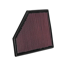 K&N red pleated high performance air filter on a white background