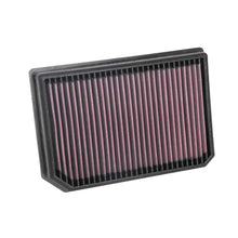 K&N red pleated high performance air filter on a white background