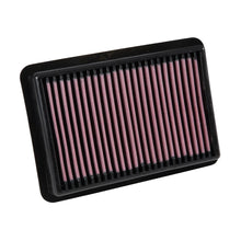 K&N red pleated high performance air filter on a white background