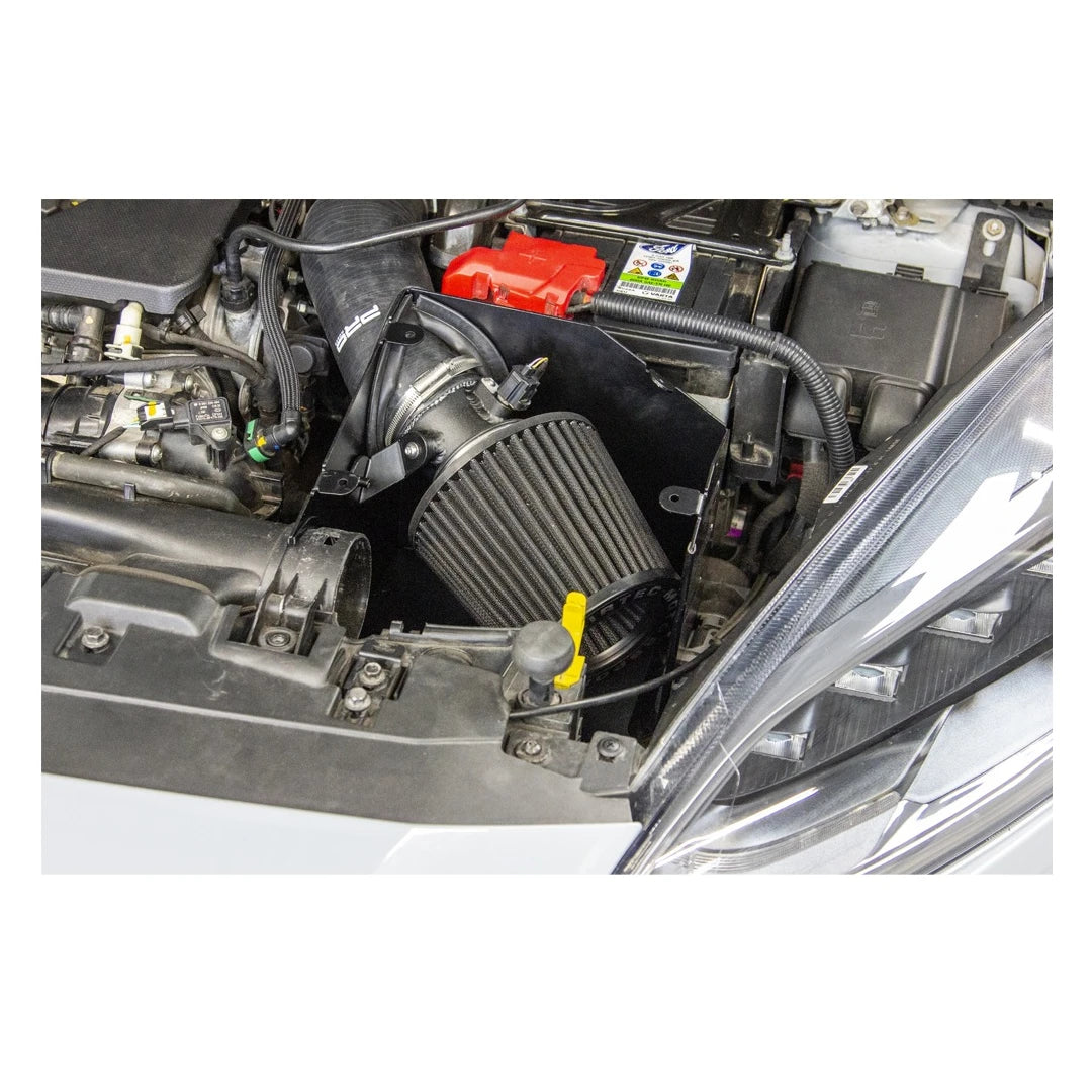 Car engine with a black air filter and red battery