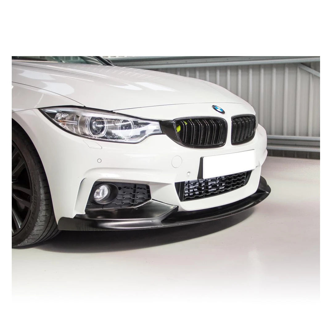 White BMW car with a black front bumper lip on a white background