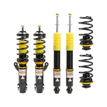 Set of four yellow speed racing coilovers on a white background