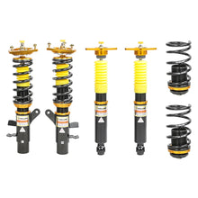 Set of four yellow speed racing coilovers on a white background