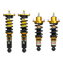 Set of four yellow speed racing coilovers on a white background