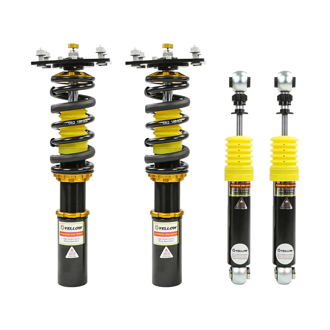 Set of four yellow speed racing coilovers on a white background