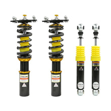 Set of four yellow speed racing coilovers on a white background
