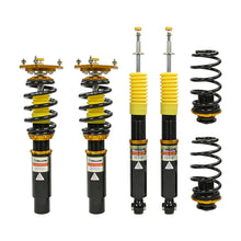 Set of four yellow speed racing coilovers on a white background
