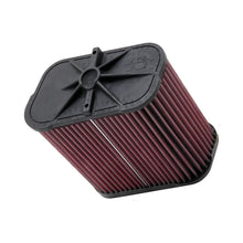K&N red pleated high performance air filter on a white background
